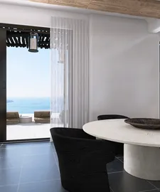 modern dining area featuring a round marble table and black upholstered chairs with ocean view, showcasing elegant interior design; utilizes Homestyler's realistic 3D rendering for renovation previews