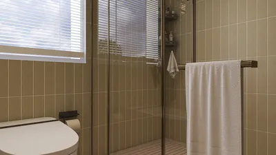 modern bathroom design showcasing a sleek shower area with glass enclosure and a towel rack, featuring neutral color tones and emphasizing interior decor aesthetics; utilizing Homestyler's real-time 3D rendering feature for effective design presentation.