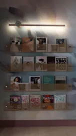 magazine wall display showcasing various art and design journals, featuring stylish layout, enhancing reading corner value, designed with Homestyler's real-time 3D rendering capabilities.