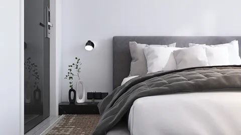 modern bedroom design featuring a cozy bed arrangement with decorative pillows and a warm gray blanket, highlighting interior decor with a minimalist aesthetic; utilizing Homestyler's real-time 3D rendering for an accurate preview of the setup.