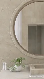 Minimalist bathroom vanity with round mirror and potted plant, showcasing modern interior decor, utilizing Homestyler's real-time 3D rendering feature.
